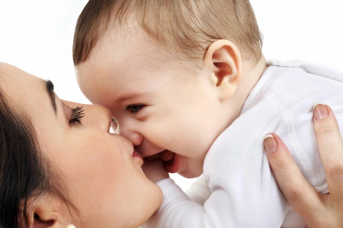 Child's Love - Mother Kissing Her Cute Baby