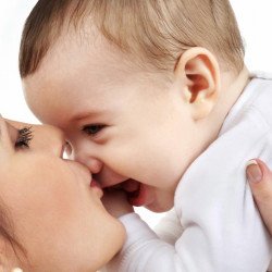 Child's Love - Mother Kissing Her Cute Baby Child's Love - Mother Kissing Her Cute Baby