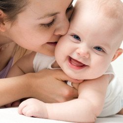 Child's Love - Mummy Kissing Her Baby Child's Love - Mummy Kissing Her Baby