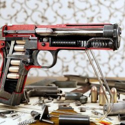 Pistol And Bullet On Wall Pistol And Bullet On Wall