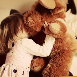 Cute Child Playing With Teddy Bear