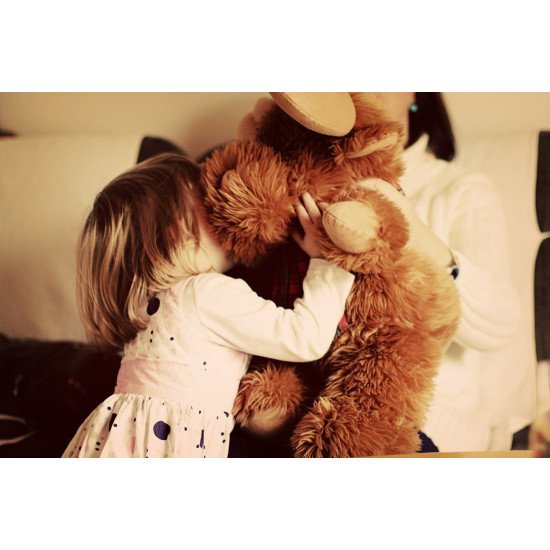 Cute Child Playing With Teddy Bear