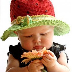 Cute Baby Playing With Flower