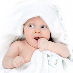 Cute Baby In A White Towel