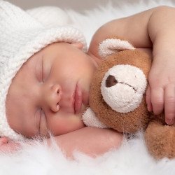Cute Baby Sleeping With Teddy
