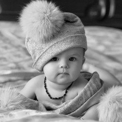 Child's Love- Baby Wearing Pom Pom Hat Child's Love- Baby Wearing Pom Pom Hat