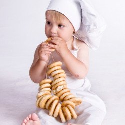 Child's Love - Chef Girl Eating Doughnut Child's Love - Chef Girl Eating Doughnut