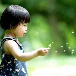 Child's Love -  Cute Girl Playing In The Garden Child's Love -  Cute Girl Playing In The Garden