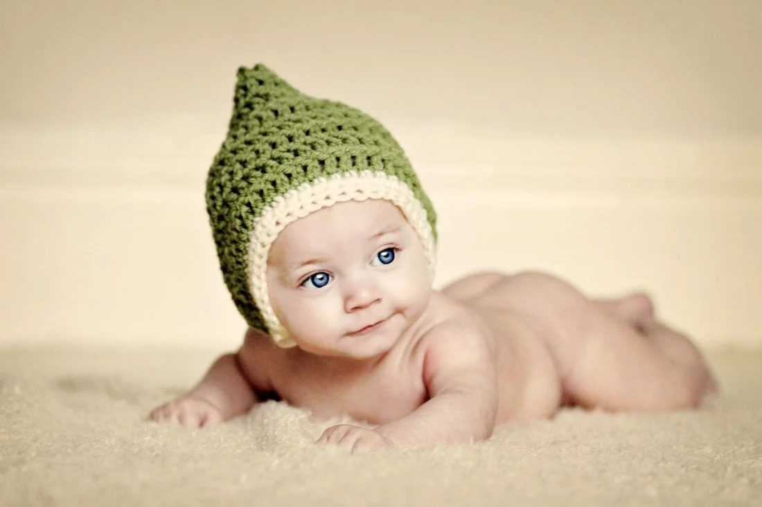 Child's Love - Cute Baby In A Green Hat