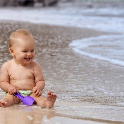 Child's Love - Cute Baby Playing At Sea Shore Child's Love - Cute Baby Playing At Sea Shore